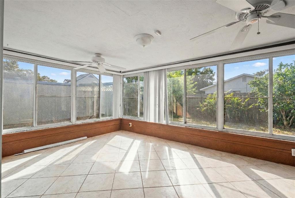 11200 Tamarix Avenue Port Richey, FL 34668 - Photo 22 of 28 a view of an empty room with a window