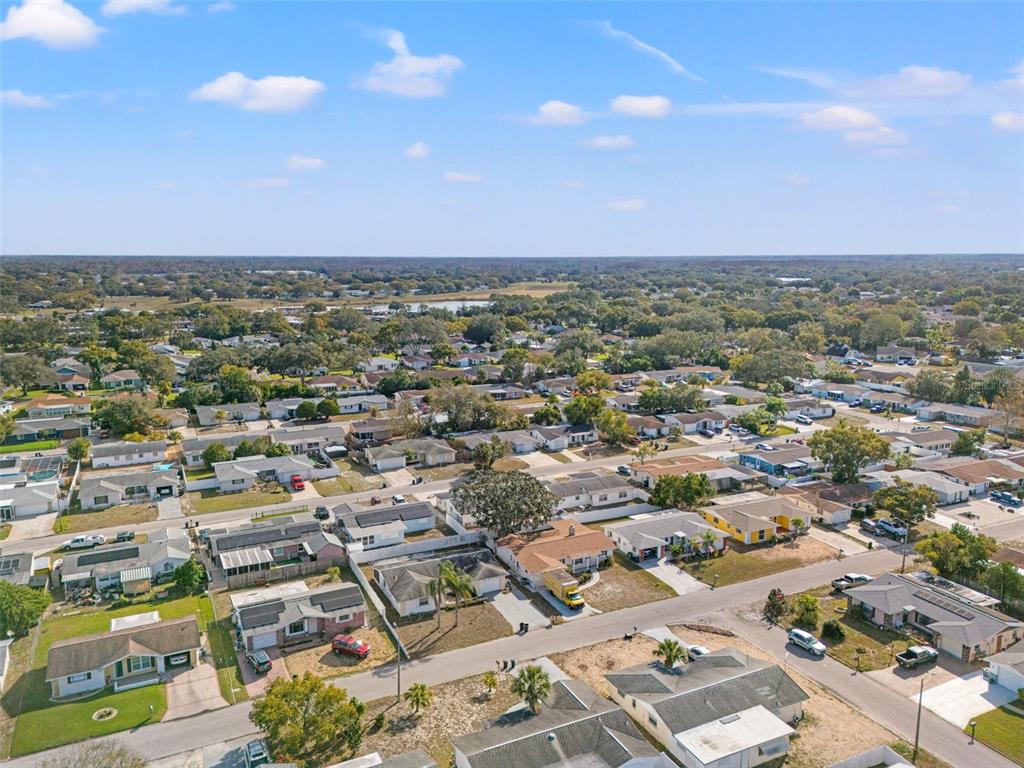 11200 Tamarix Avenue Port Richey, FL 34668 - Photo 26 of 28 an aerial view of residential houses with outdoor space