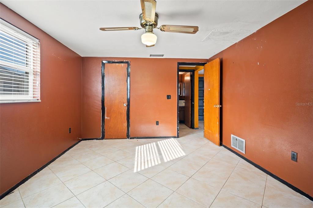 11200 Tamarix Avenue Port Richey, FL 34668 - Photo 9 of 28 a view of an empty room with a window