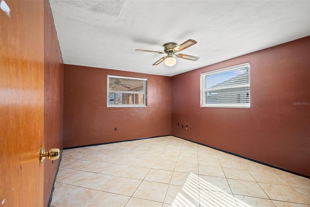 11200 Tamarix Avenue Port Richey, FL 34668 - Photo 10 of 28 a view of an empty room with a window