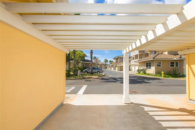an outdoor space with lots of swings and slides and yard
