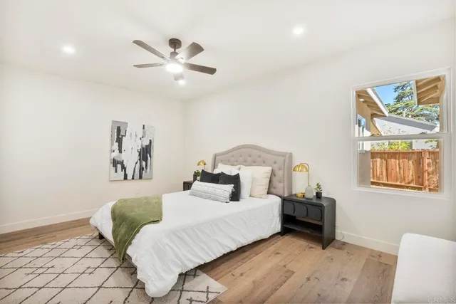 a bedroom with a bed and a couch