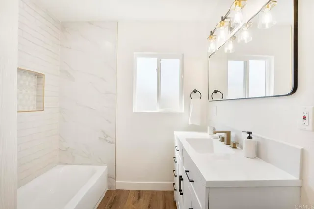 a bathroom with a sink and a bathtub