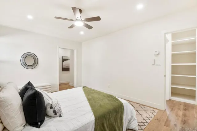 a bedroom with a bed and a closet