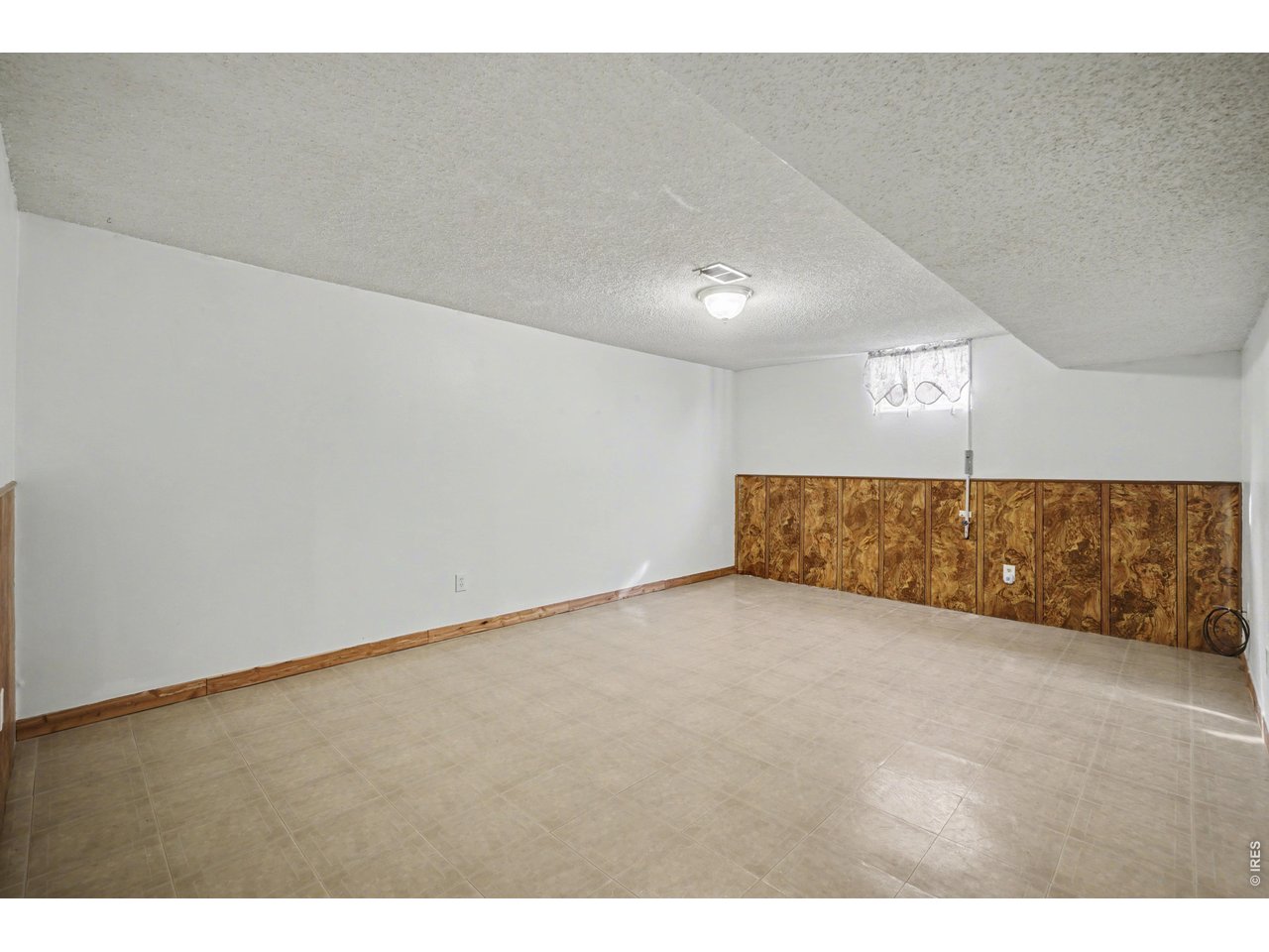 3711 West 7th Street Road Greeley, CO 80634 - Photo 22 of 39 Head downstairs to find plenty of room to spread out and relax!