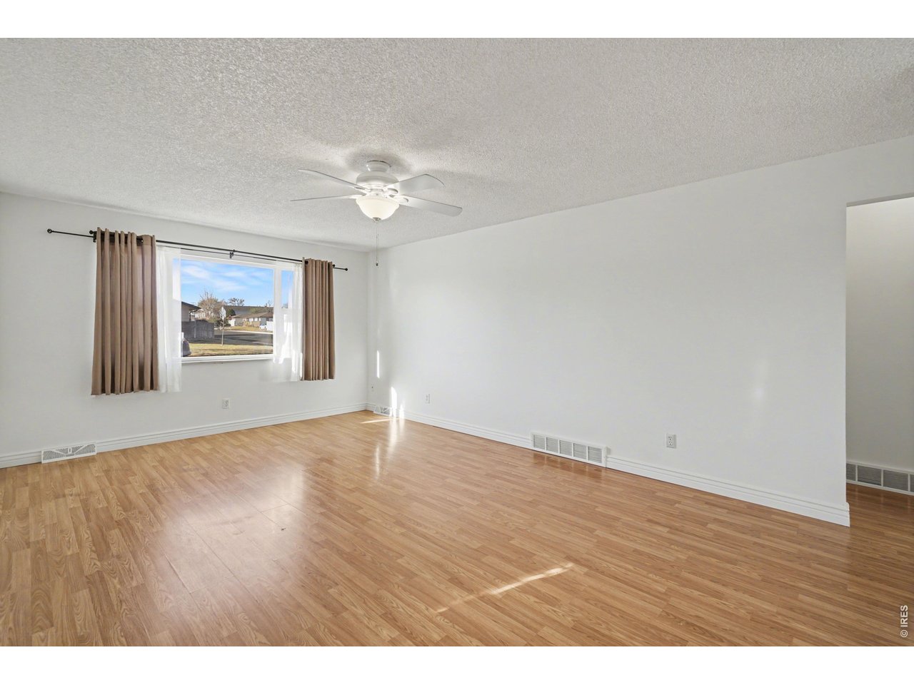 3711 West 7th Street Road Greeley, CO 80634 - Photo 3 of 39 The living room is spacious and bright