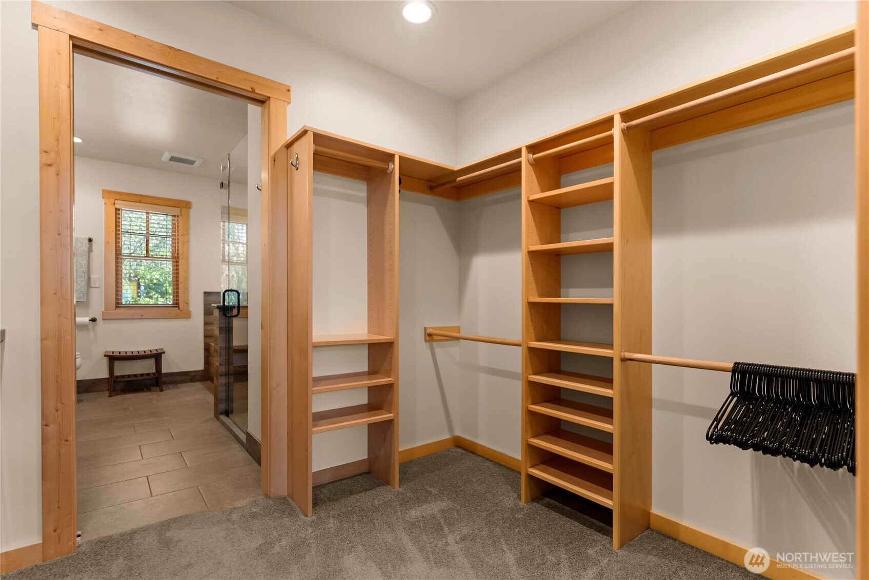130 Sundown Road Winthrop, WA 98862 - Photo 21 of 40 a view of walk in closet with clothes and shoes