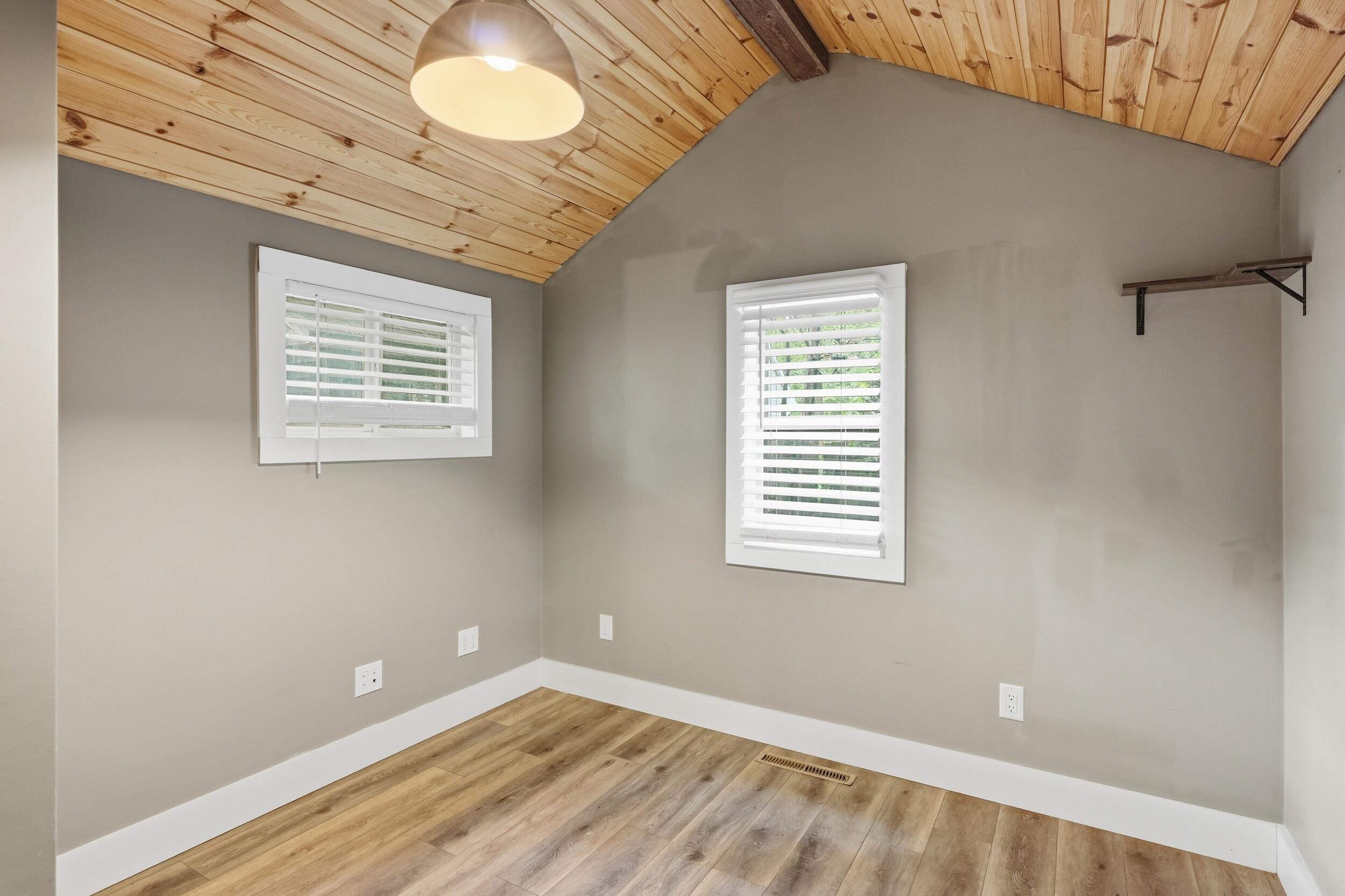 1307 Redwing Road Valparaiso, IN 46383 - Photo 12 of 20 a view of an empty room with a window and wooden floor