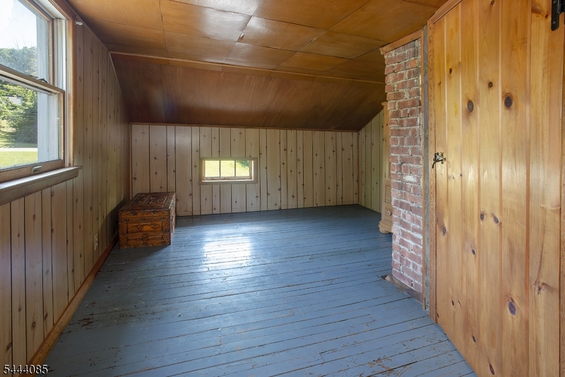 79 Lake Wallkill Road Vernon, NJ 07461 - Photo 21 of 27 a view of empty room with wooden floor and fan