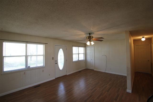 90 Winnie Boynton Road Manchester, TN 37355 - Photo 3 of 20 wooden floor in an empty room with a window
