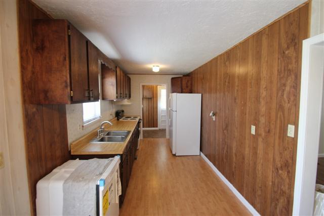 90 Winnie Boynton Road Manchester, TN 37355 - Photo 9 of 20 a view of a kitchen with refrigerator and wooden floor