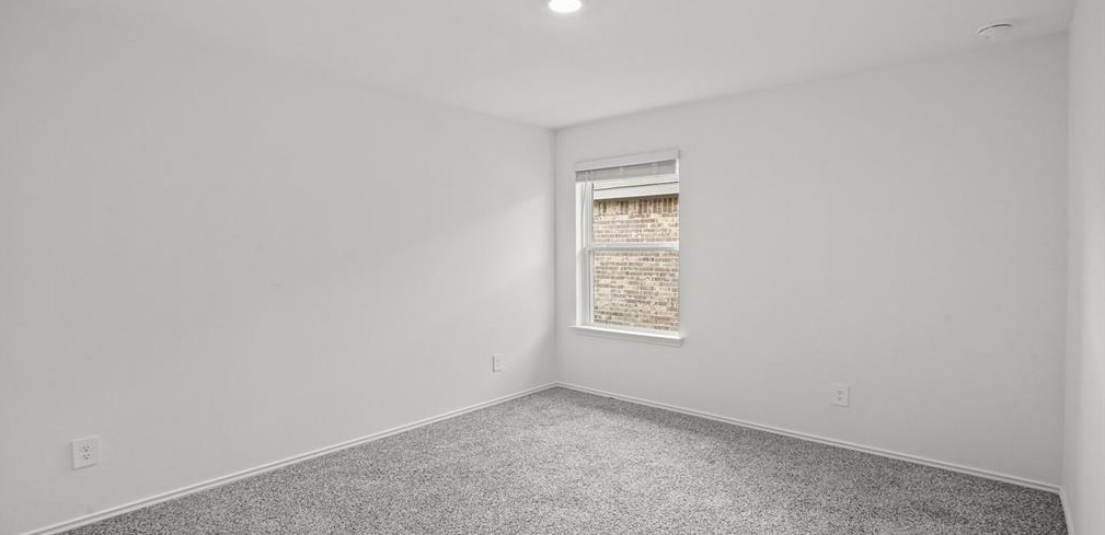 23907 Stardust Valley Dr Spring Spring, TX 77373 - Photo 2 of 9 an empty room with windows