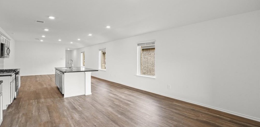 23907 Stardust Valley Dr Spring Spring, TX 77373 - Photo 4 of 9 a view of kitchen with furniture and wooden floor