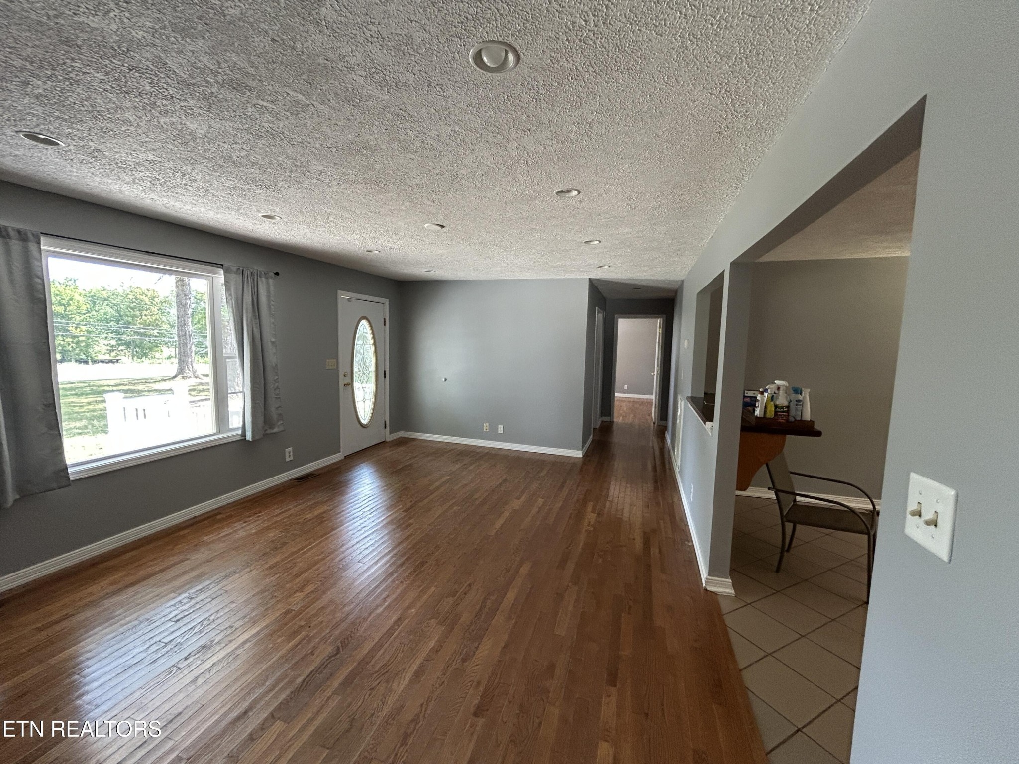 2702 Baseline Road Jamestown, TN 38556 - Photo 11 of 22 a view of a hallway with wooden floor and windows