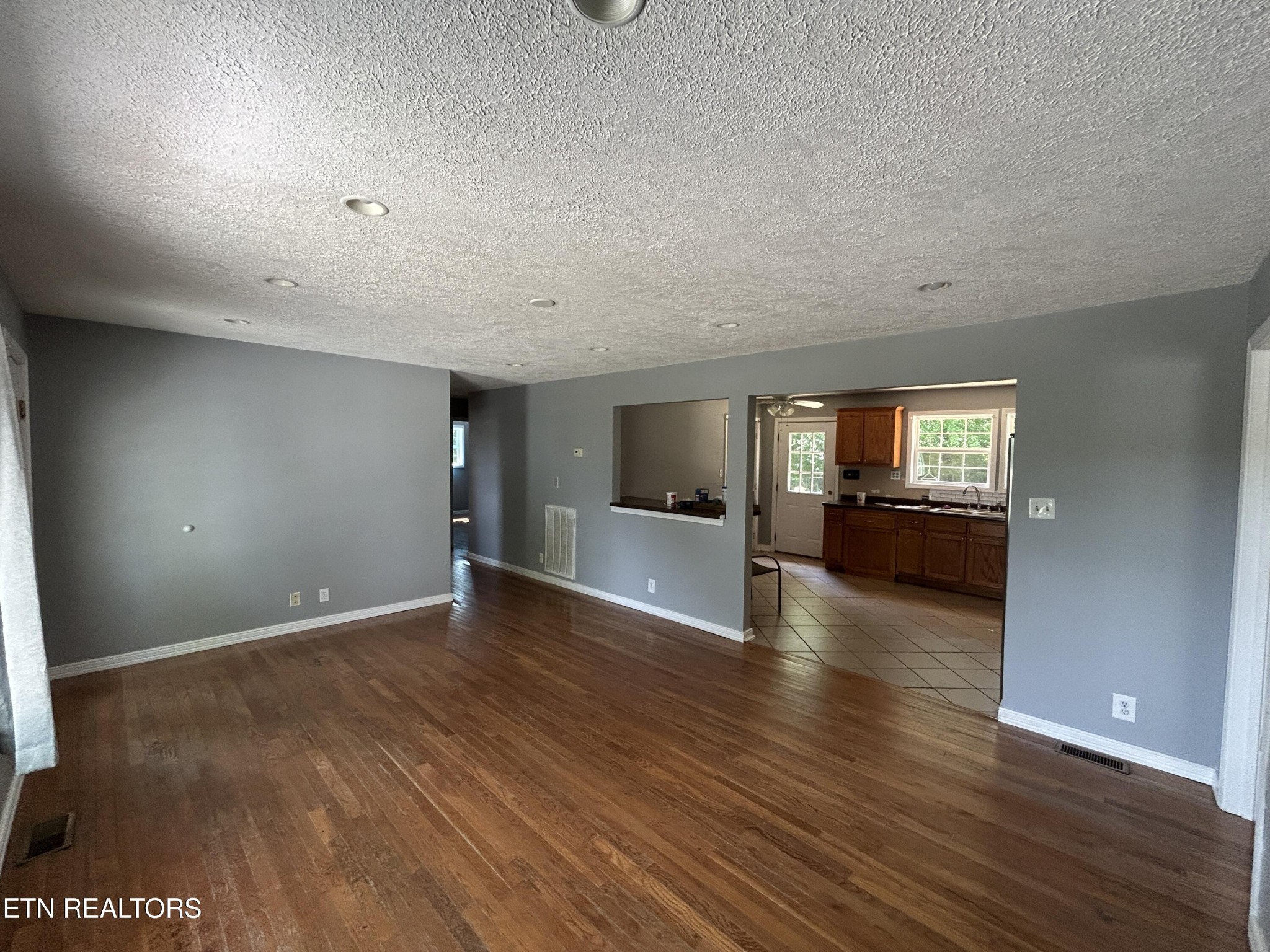 2702 Baseline Road Jamestown, TN 38556 - Photo 13 of 22 a view of empty room with wooden floor