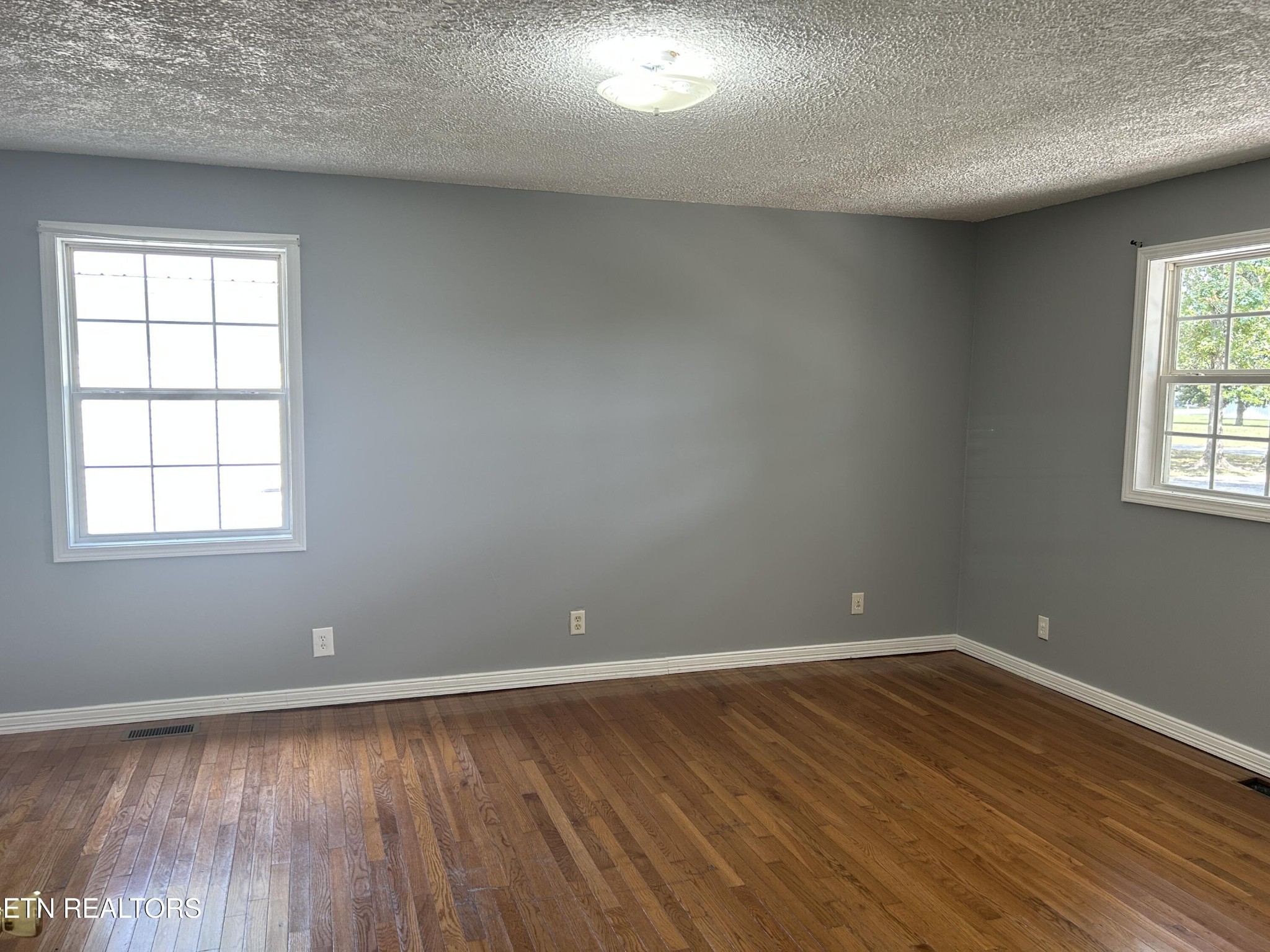 2702 Baseline Road Jamestown, TN 38556 - Photo 14 of 22 wooden floor in an empty room with a window