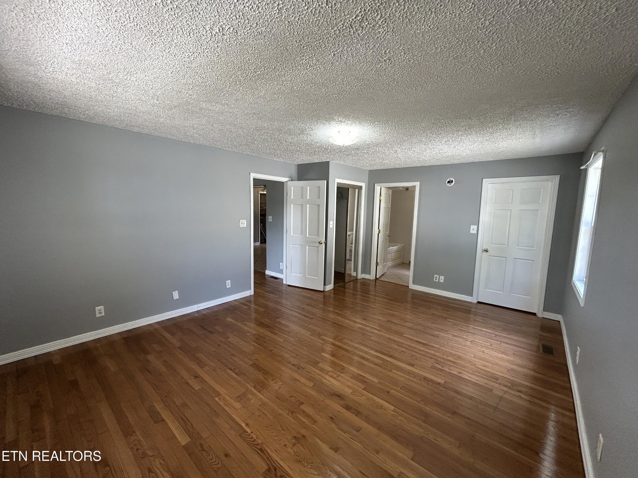 2702 Baseline Road Jamestown, TN 38556 - Photo 15 of 22 a view of an empty room with wooden floor