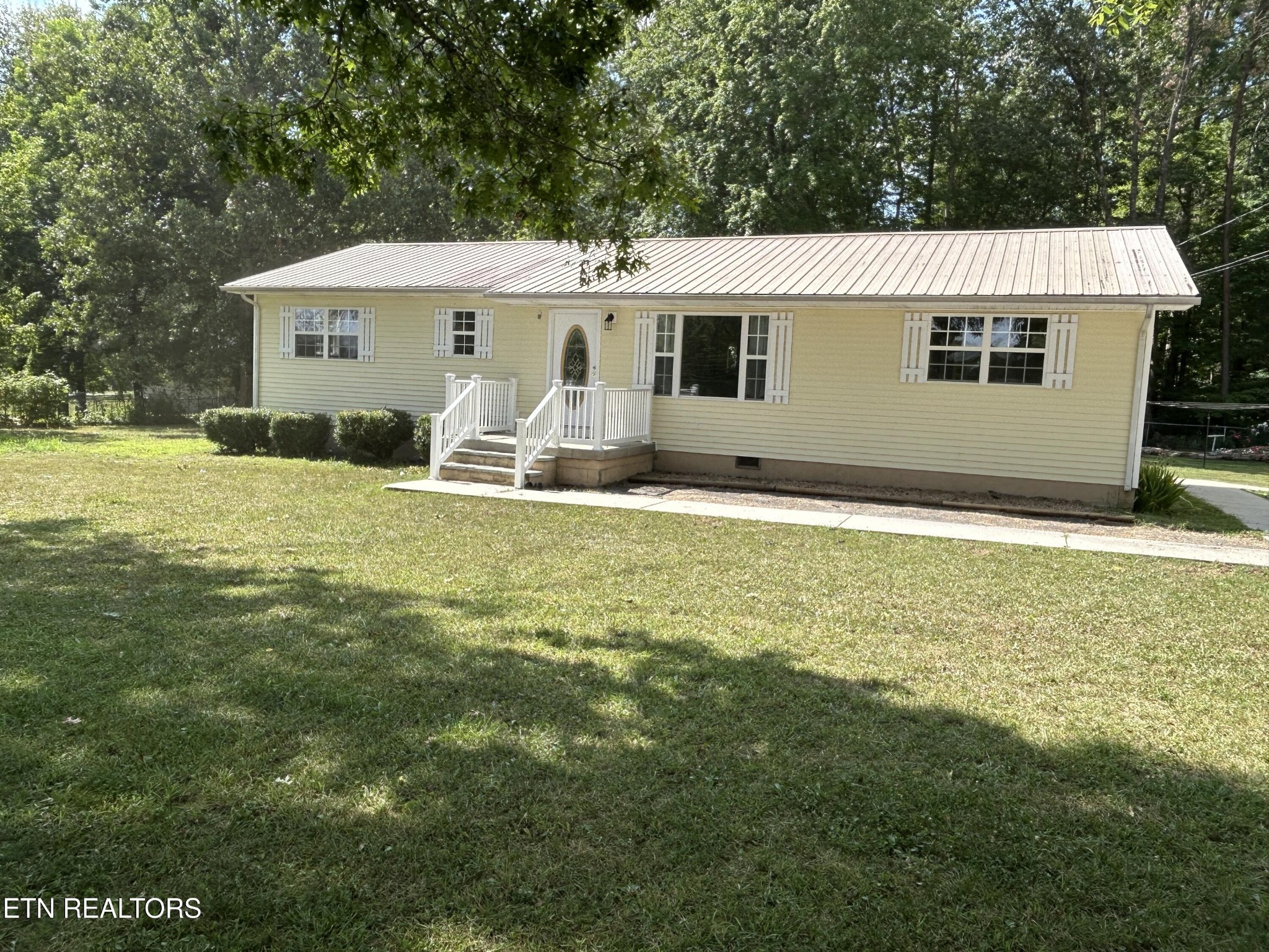 2702 Baseline Road Jamestown, TN 38556 - Photo 5 of 22 a view of a house with a yard and sitting area