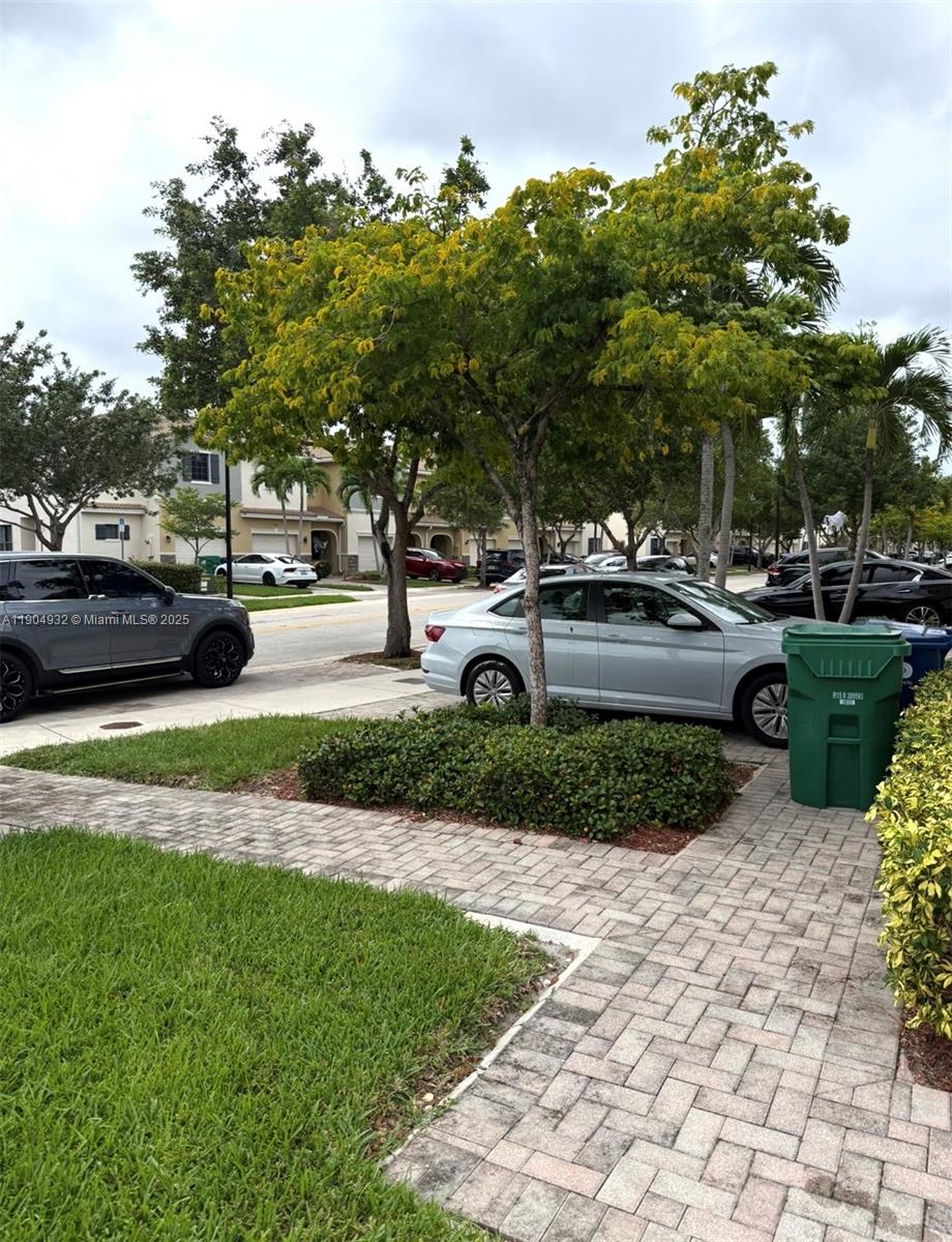 481 Northeast 194th Terrace, Unit 481 Miami, FL 33179 - Photo 21 of 23 a house view with a garden space