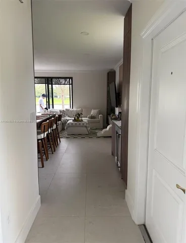 a living room with lots of furniture and a window