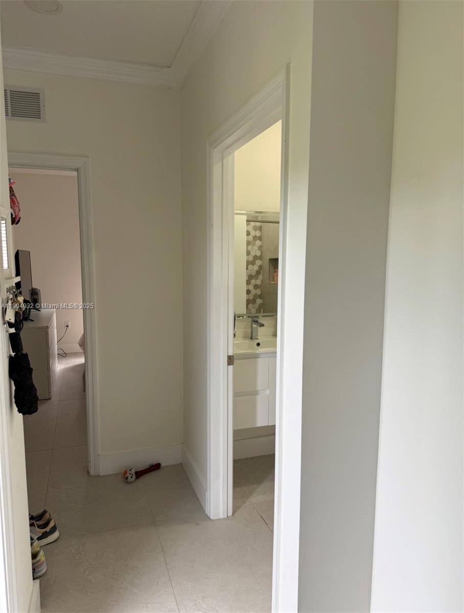 481 Northeast 194th Terrace, Unit 481 Miami, FL 33179 - Photo 6 of 23 an entryway with a door