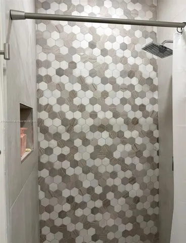 a bathroom with a shower curtain