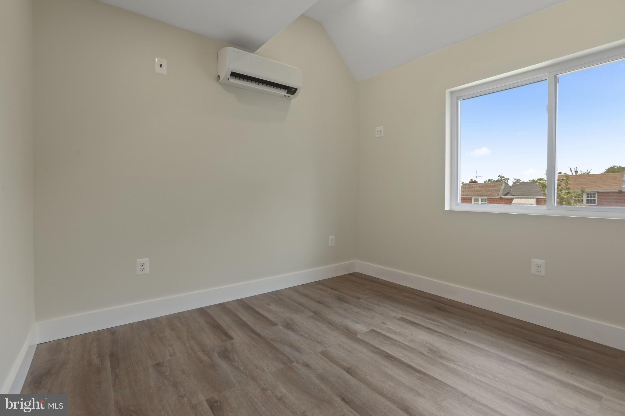 3828 10th Street Baltimore, MD 21225 - Photo 12 of 27 wooden floor in an empty room