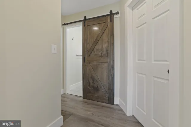 a view of a bathroom from a hallway