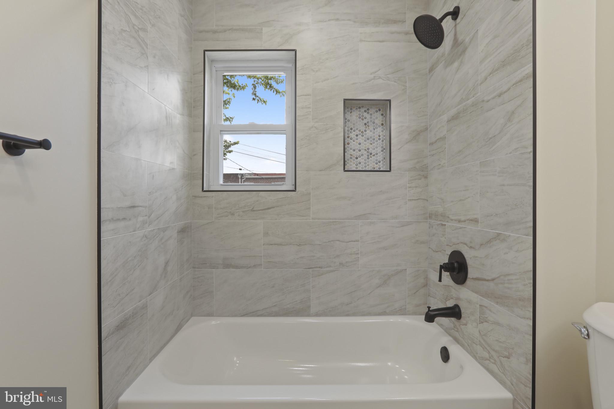 3828 10th Street Baltimore, MD 21225 - Photo 16 of 27 a bathroom with a bathtub