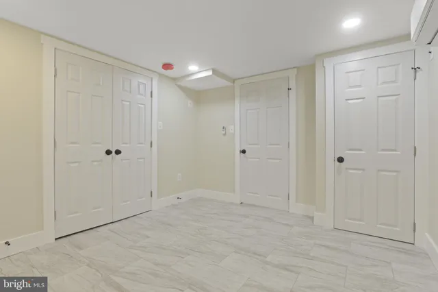 a bathroom with a granite countertop sink mirror and shower