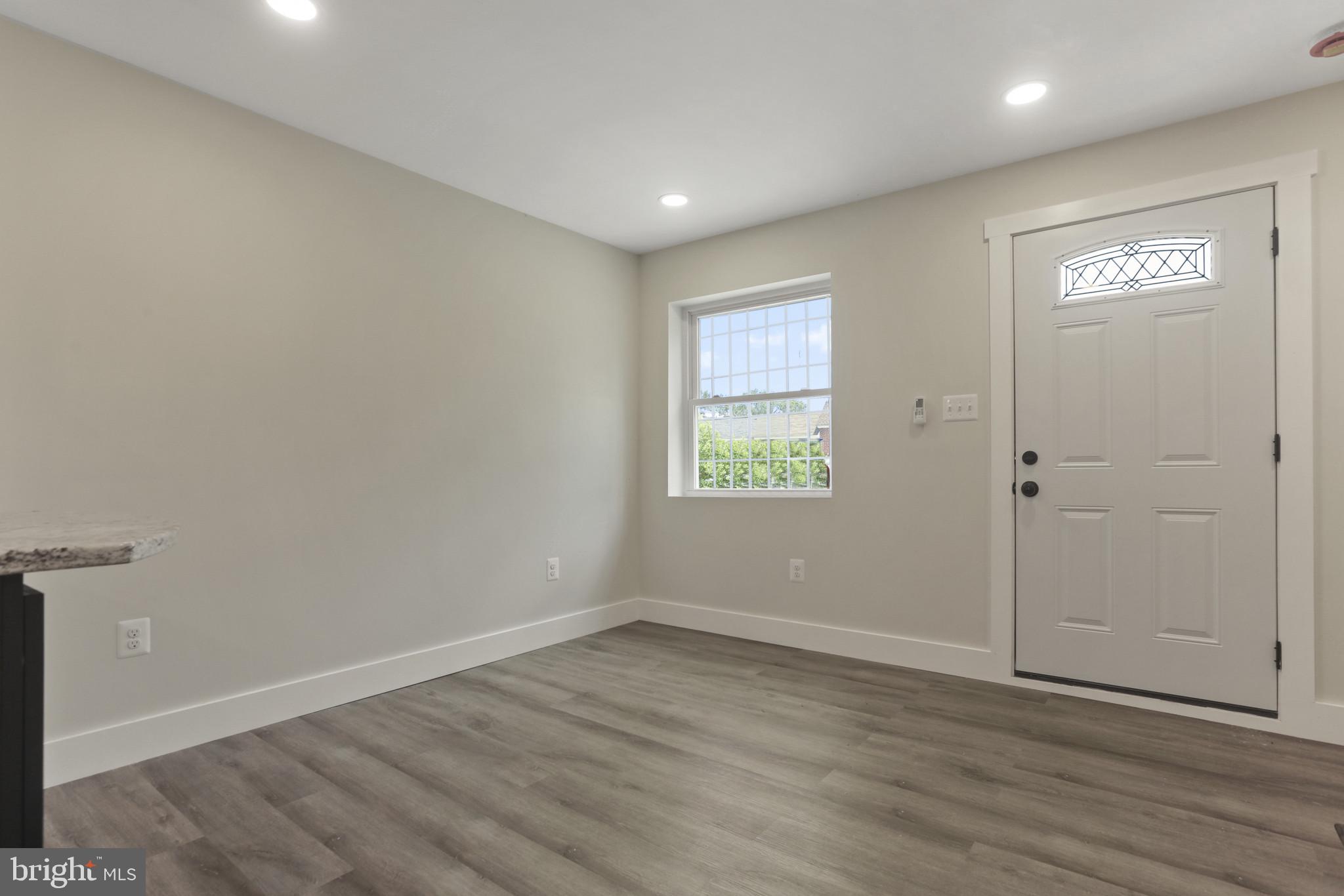 3828 10th Street Baltimore, MD 21225 - Photo 2 of 27 wooden floor in an empty room