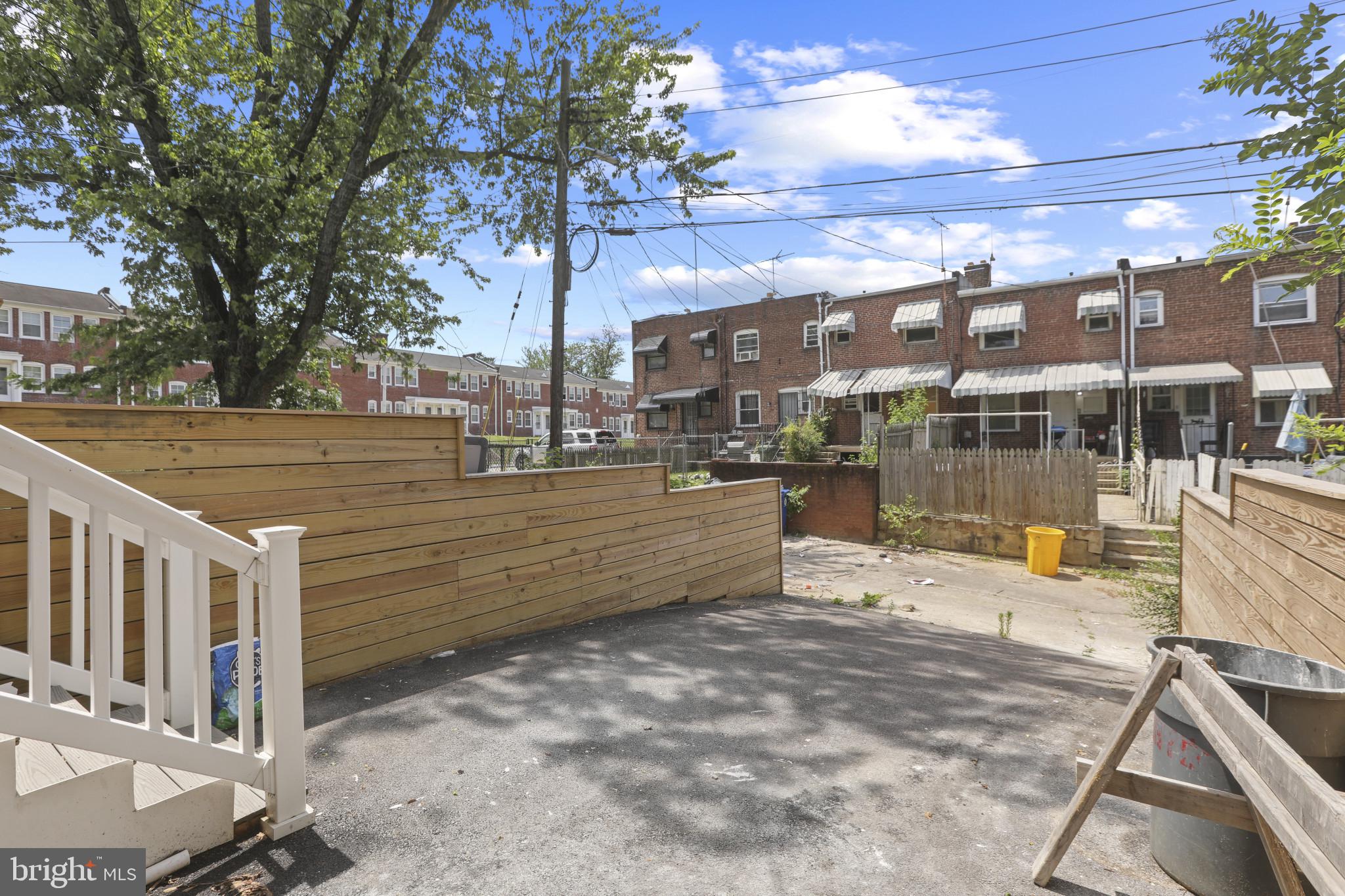 3828 10th Street Baltimore, MD 21225 - Photo 25 of 27 a view of a building with a bench