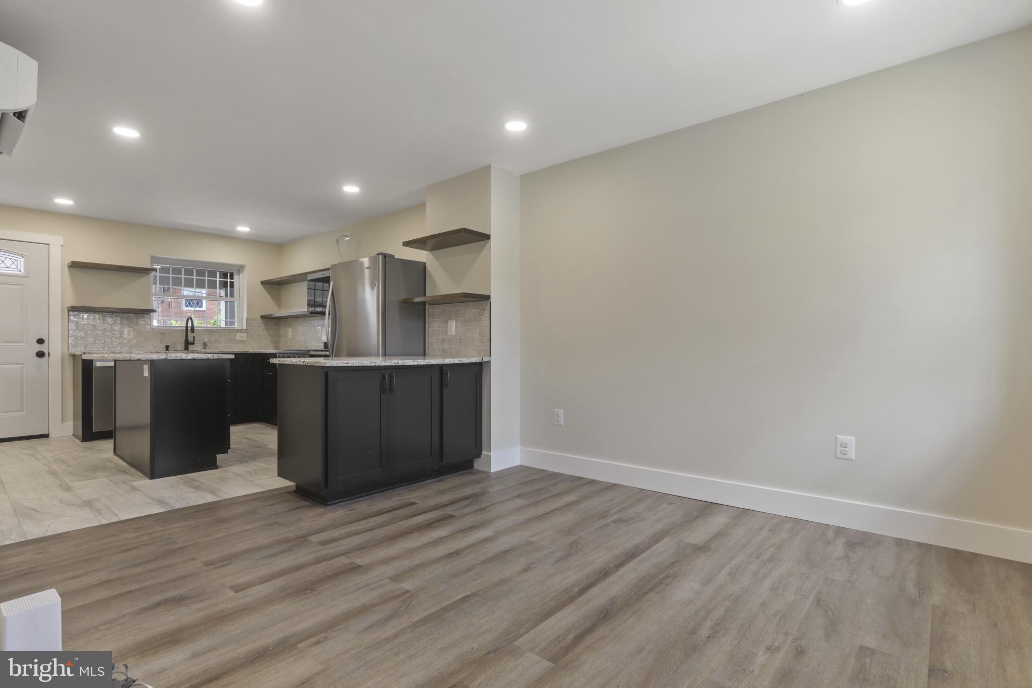 3828 10th Street Baltimore, MD 21225 - Photo 4 of 27 a view of kitchen with wooden floor
