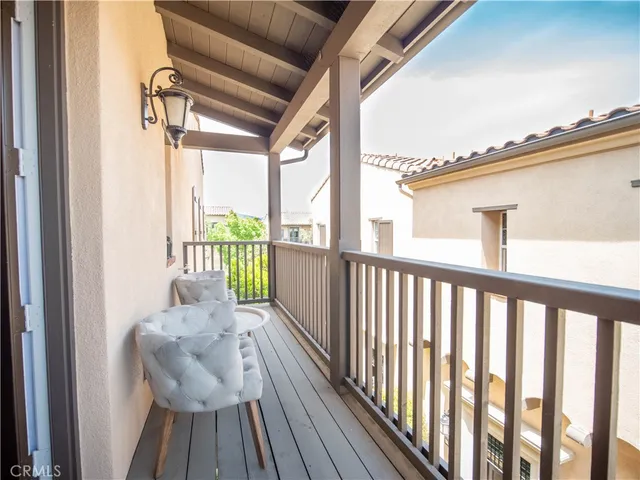 a view of balcony with furniture