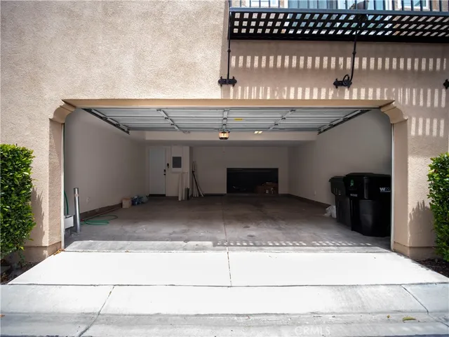 a view of staircase with black carpet