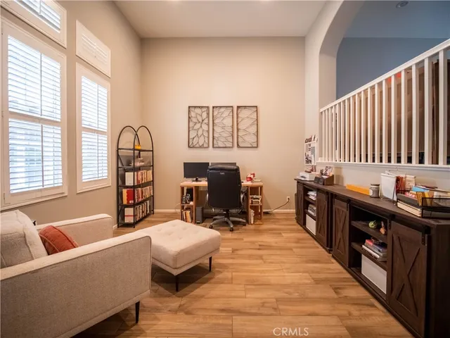 a living room with furniture window and a table