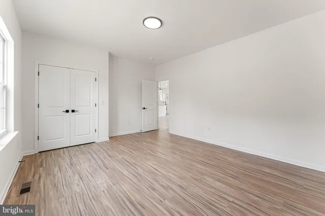 a bathroom with a bath tub with a shower