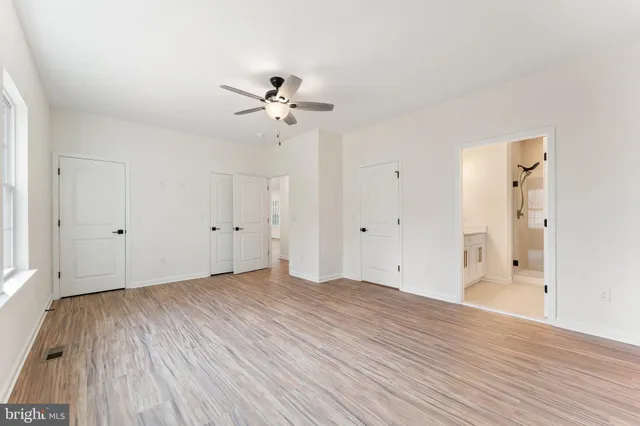 a bathroom with a double vanity sink a mirror and shower