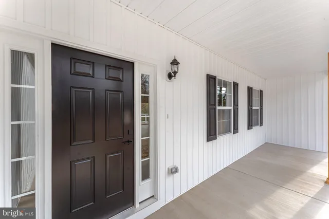 a view of kitchen with wooden floor and window