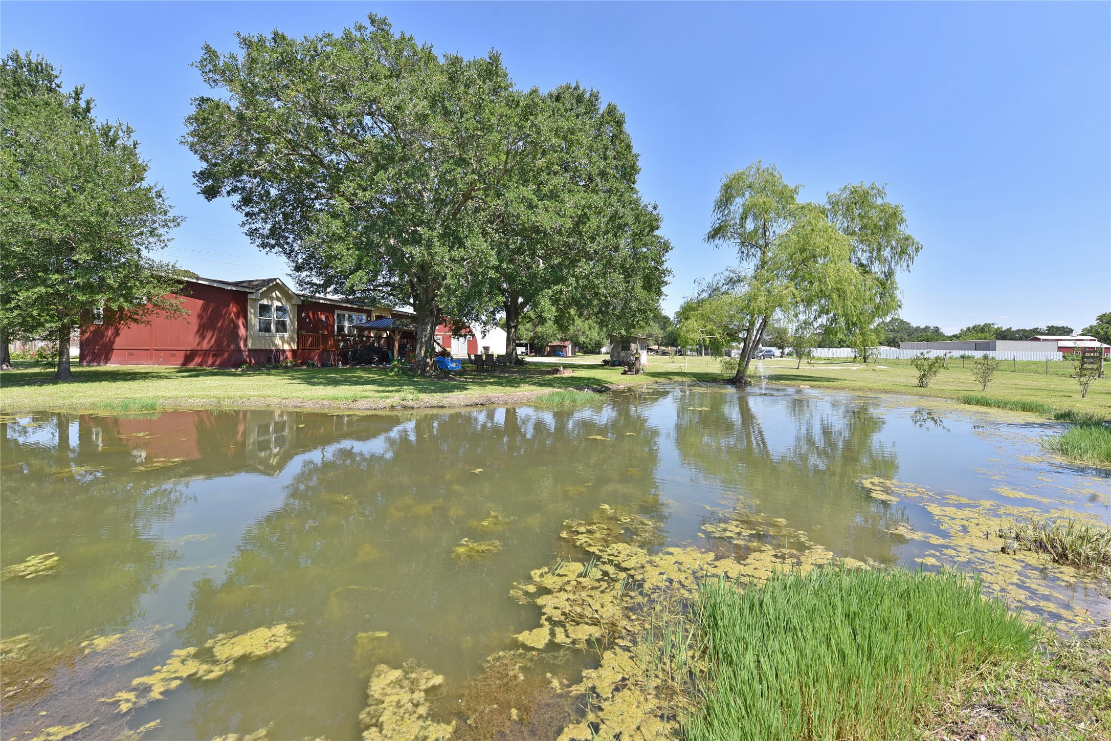 3221 Pecha Lane Rosenberg, TX 77471 - Photo 43 of 46 a view of a lake with houses in the background