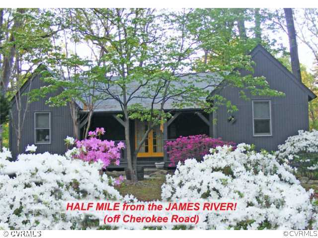 8976 Rustic Road Richmond, VA 23235 - Photo 1 of 12 a front view of house with flowers