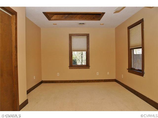 8976 Rustic Road Richmond, VA 23235 - Photo 7 of 12 a view of an empty room with a window