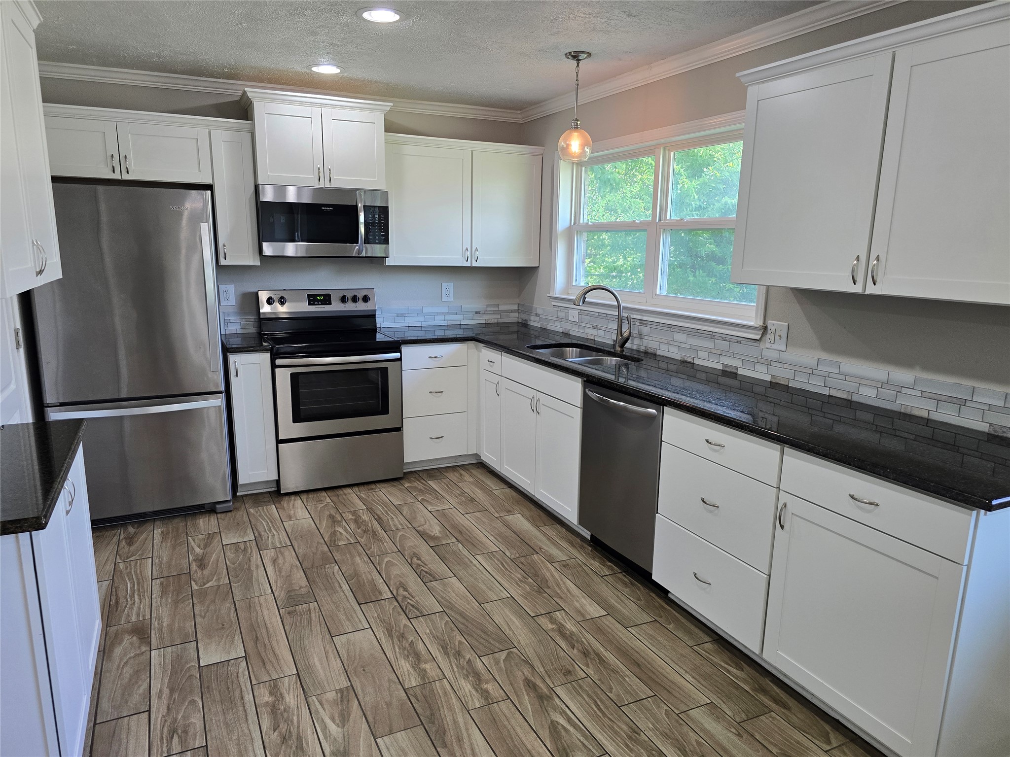 205 East Cherokee Drive Harker Heights, TX 76548 - Photo 9 of 23 A well-appointed kitchen features stainless steel appliances, ample cabinetry, and rich countertops.