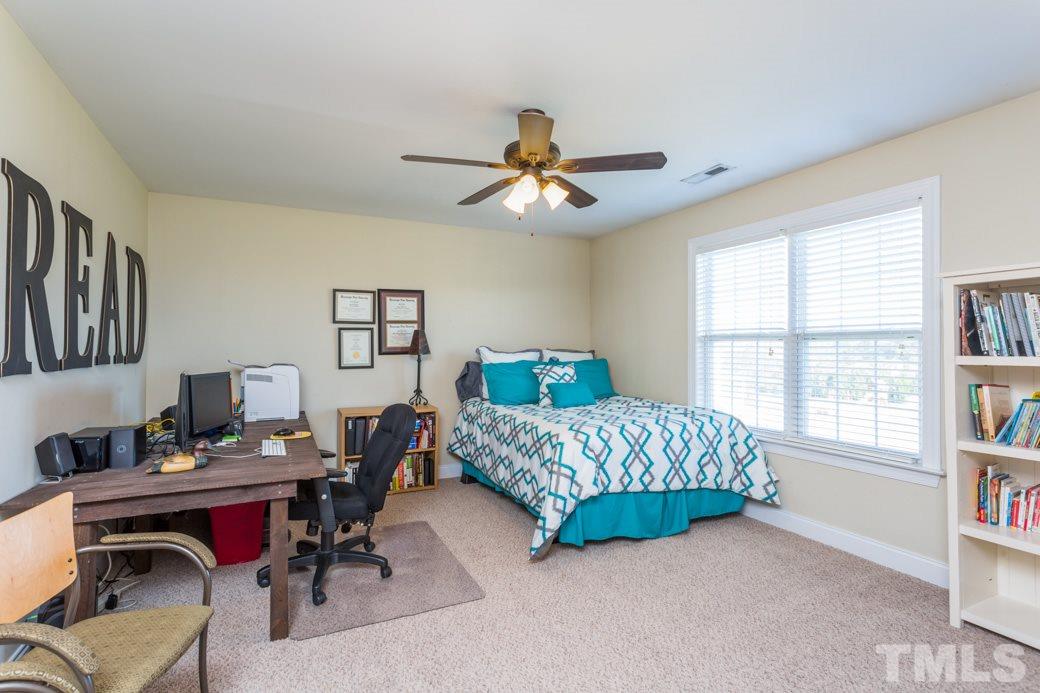 241 Ina Joe Place Willow Spring, NC 27592 - Photo 22 of 25 a living room with furniture and a window