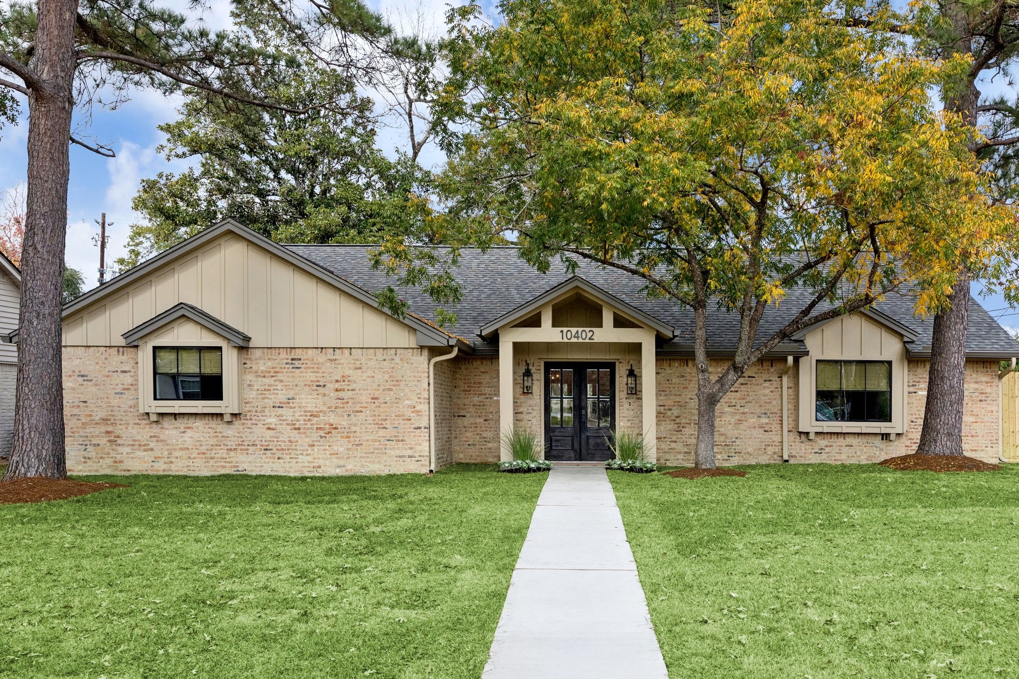 a front view of a house with garage