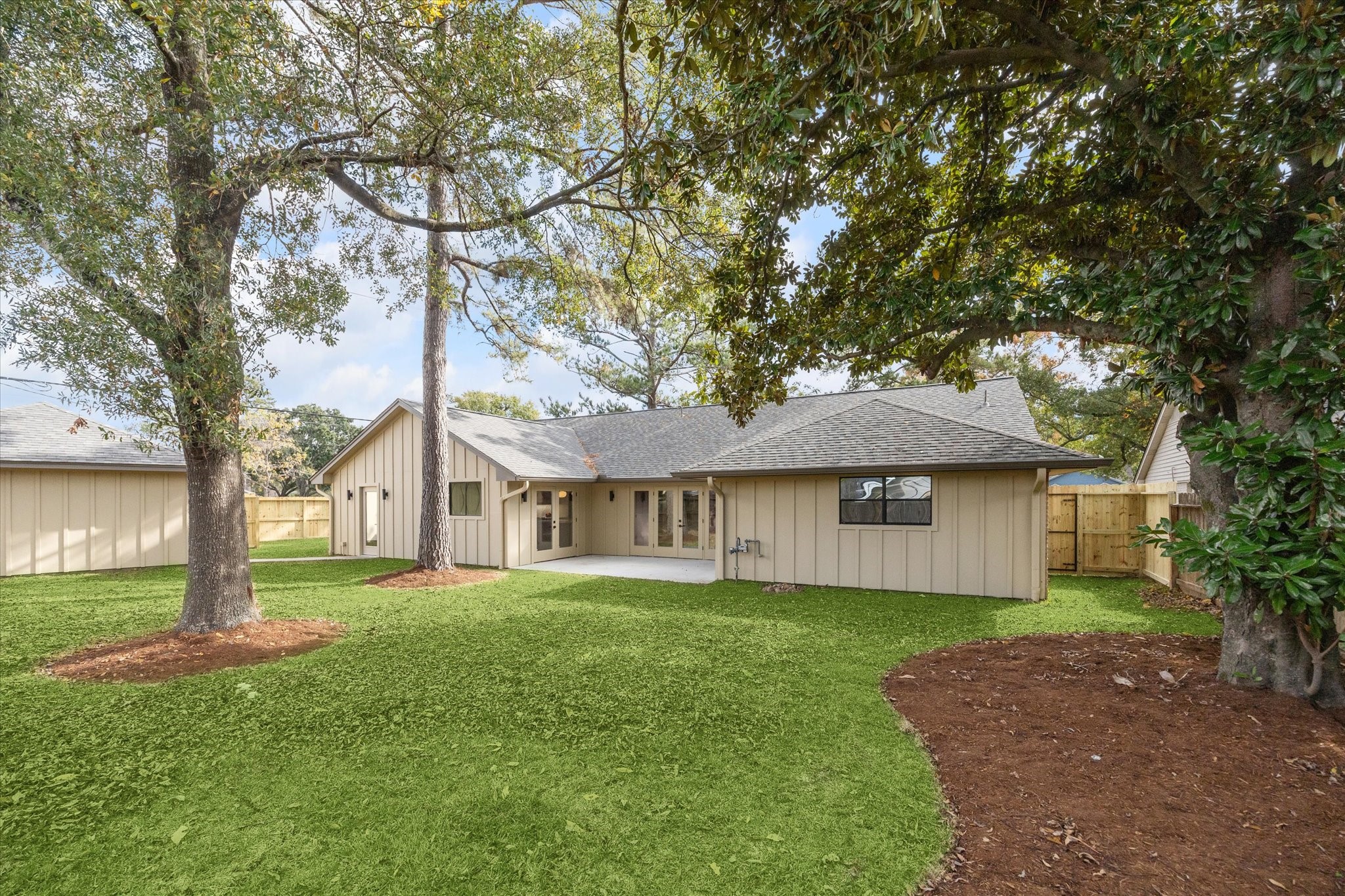 10402 Raritan Drive Houston, TX 77043 - Photo 25 of 27 a view of house with a big yard and large trees