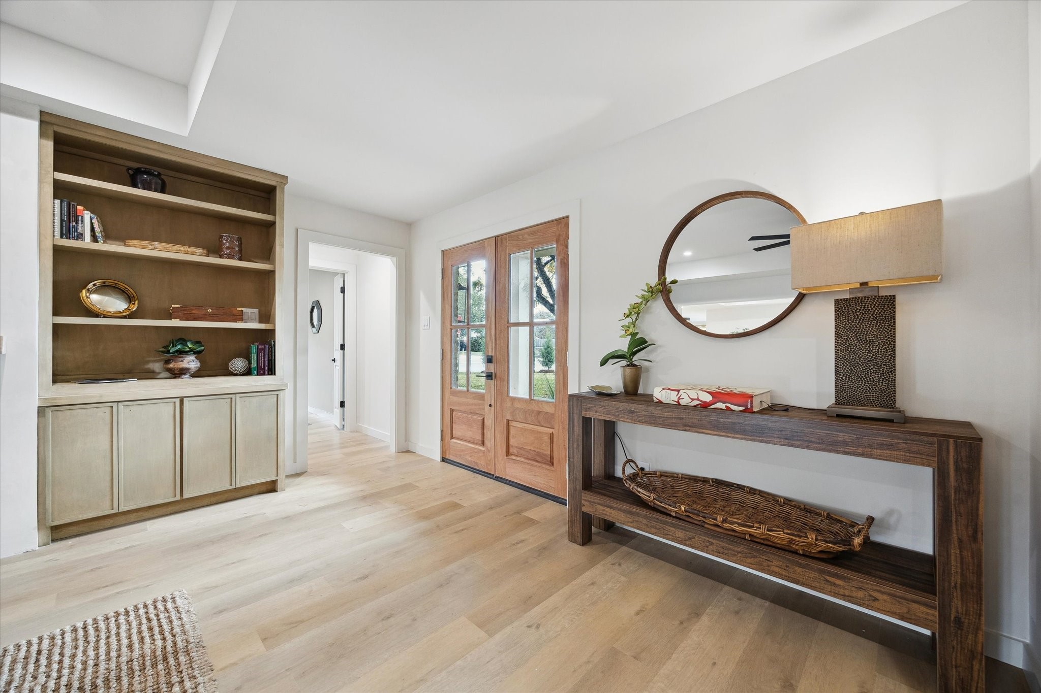 10402 Raritan Drive Houston, TX 77043 - Photo 4 of 27 a living room with hard wood floors and a window