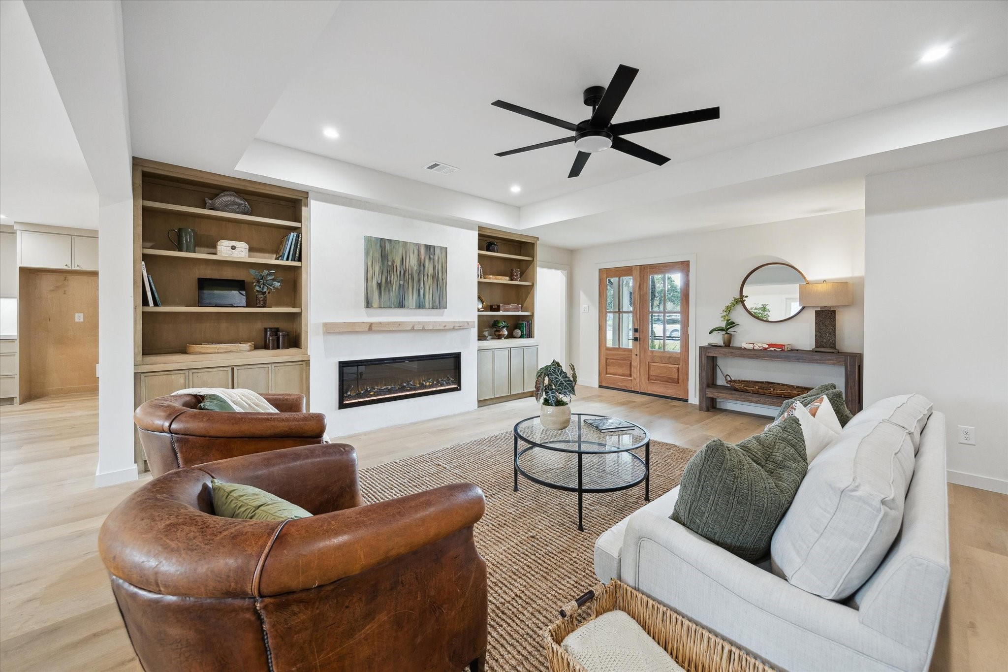 10402 Raritan Drive Houston, TX 77043 - Photo 5 of 27 a living room with furniture and a fireplace