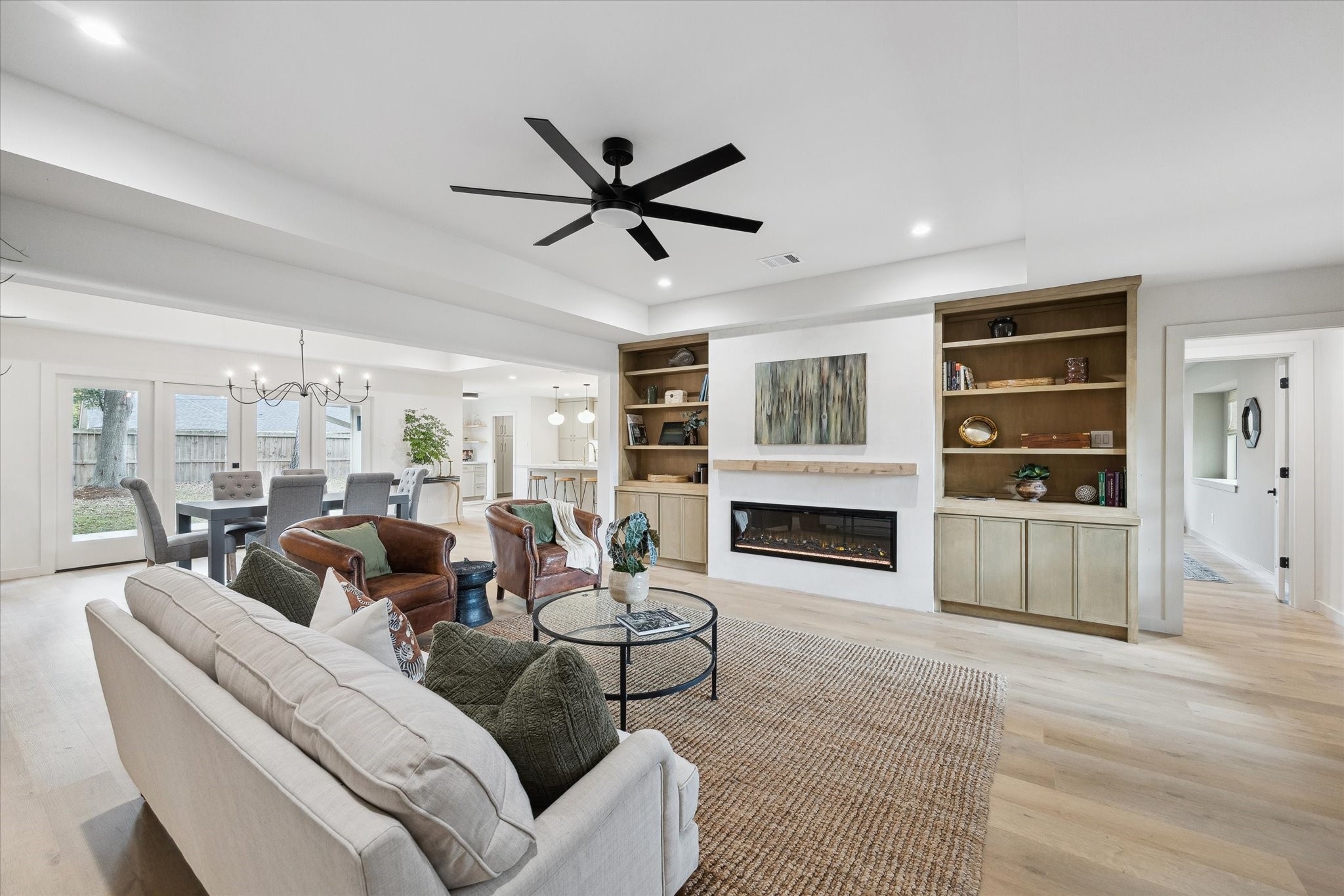 10402 Raritan Drive Houston, TX 77043 - Photo 6 of 27 a living room with fireplace furniture and a floor to ceiling window