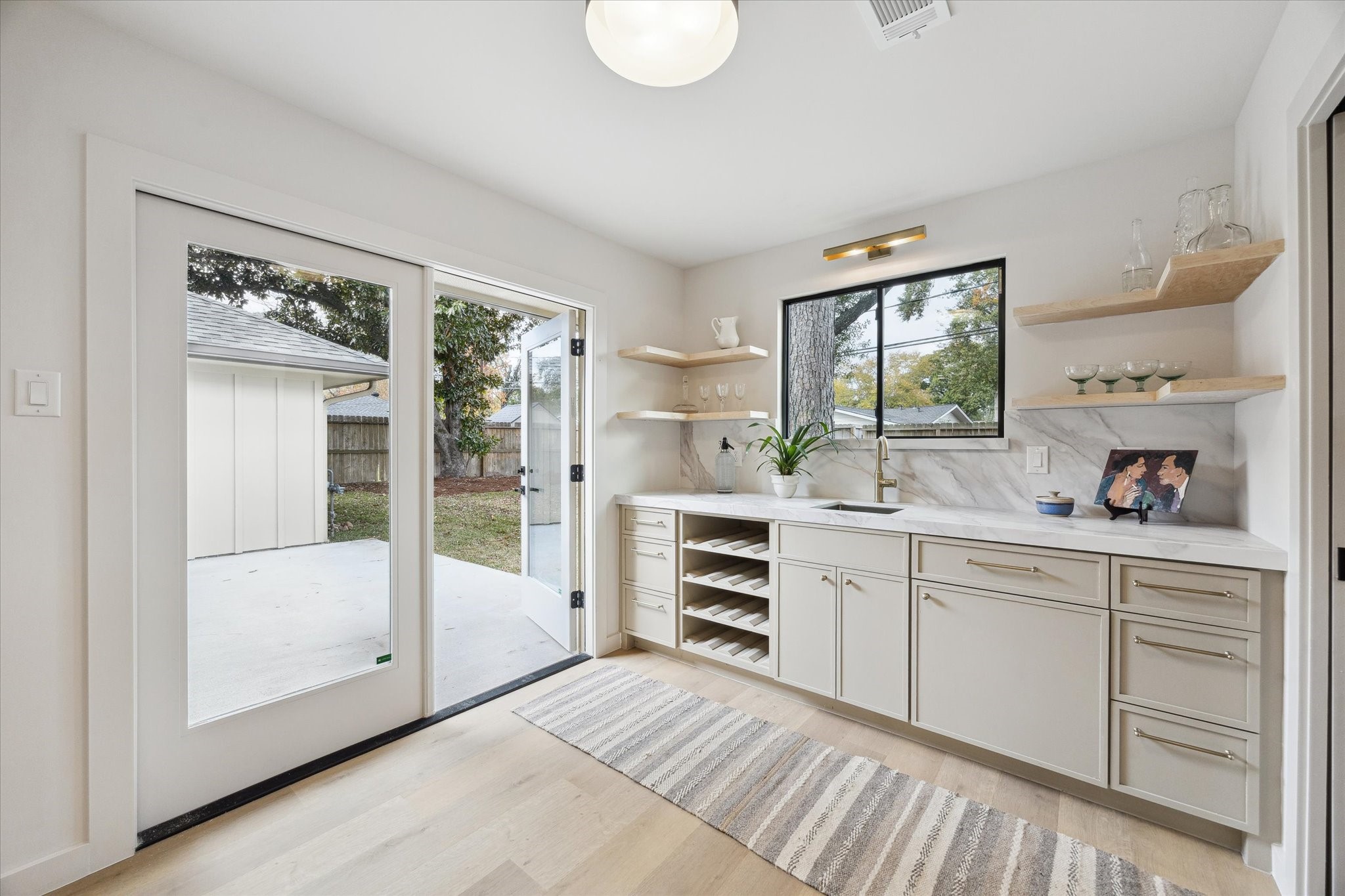 10402 Raritan Drive Houston, TX 77043 - Photo 10 of 27 a spacious bathroom with a shower sink and mirror